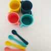 Juego de 2 vasos para bebés de silicona, coral y amarillo - Ekobo